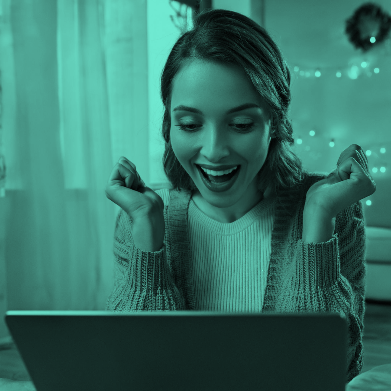 Woman_looking_Happy_Whilst_Using_Laptop