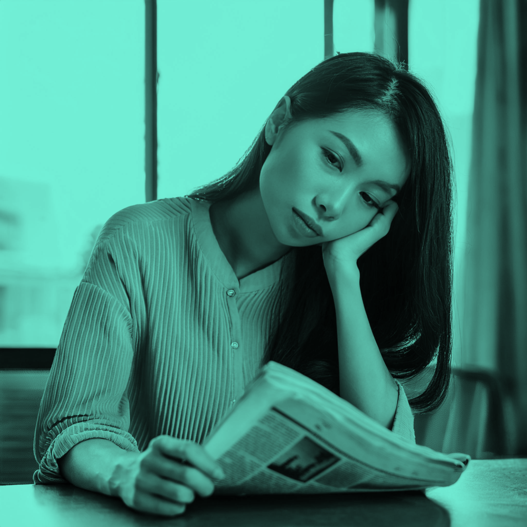 Woman_Falling_Asleep_While_Reading_Newspaper